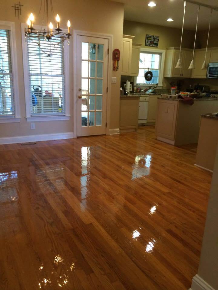 Freshly refinished hardwood floor in a converse kitchen
