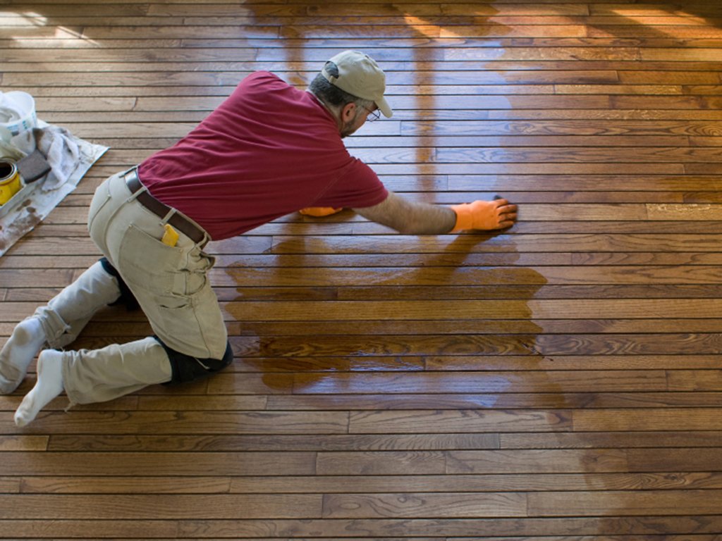 a universal city floor refinisher hard at work updating a wood floor.